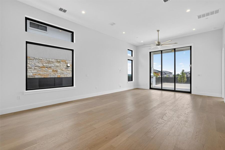 Spacious, unfurnished interior of a new home in Milky Way at River Place, Austin (Image 38).
