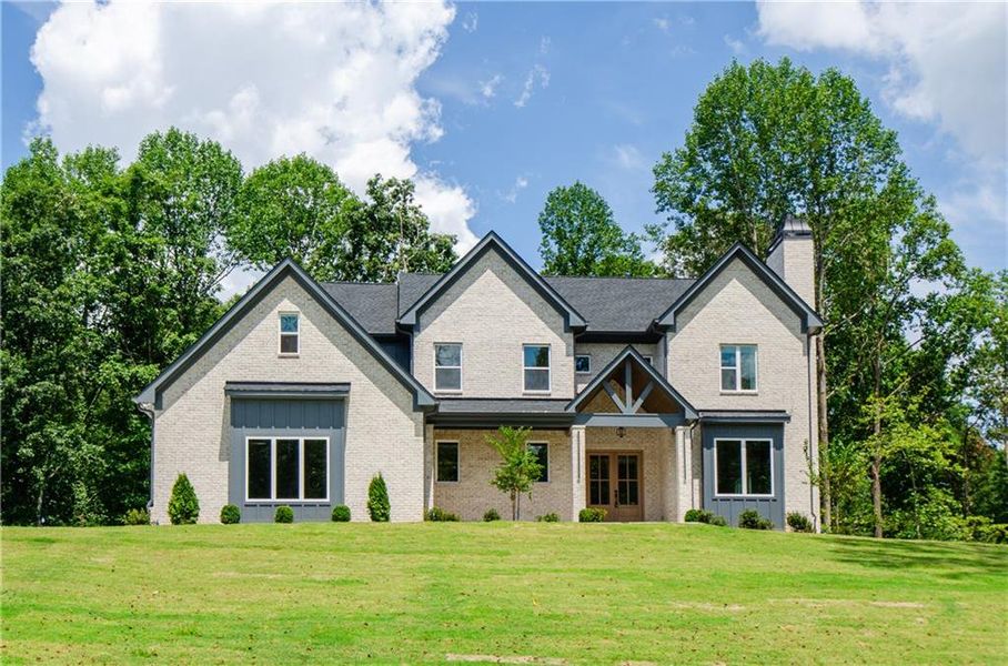 Front exterior of a new home in , Hoschton, GA, highlighting curb appeal (Image 26). Front exterior of a new home in , Hoschton, GA, highlighting curb appeal (Image 26).