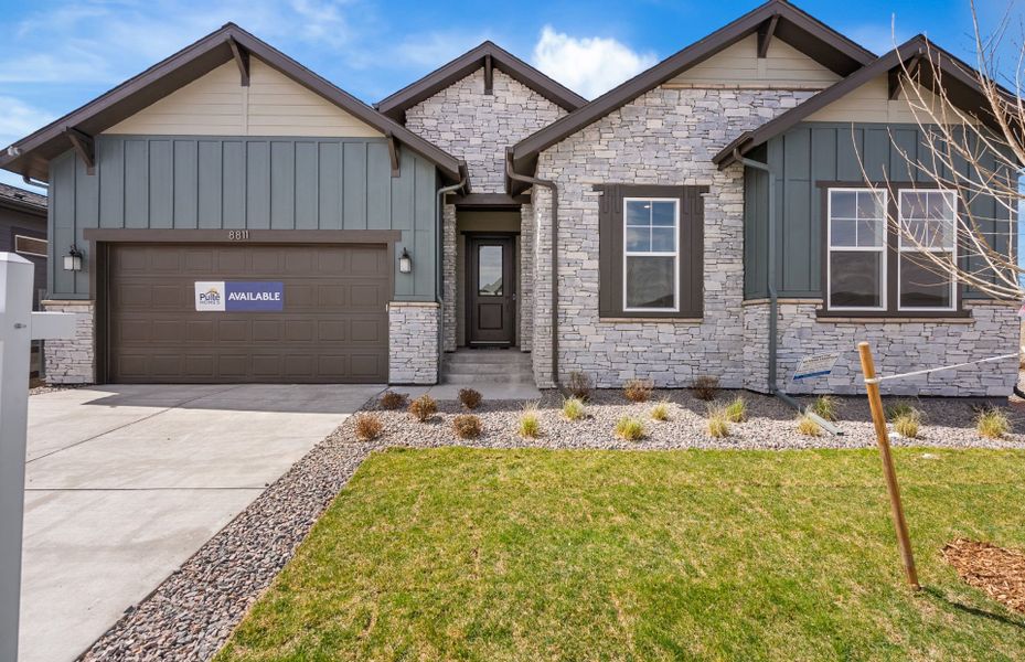 Front exterior of a new home in Hilltop at Inspiration, Aurora, CO, highlighting curb appeal (Image 26).