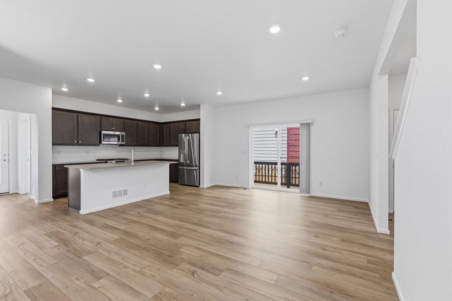 Furnished interior view inside a new home in Woodrose at Painted Prairie, Aurora (Image 4).