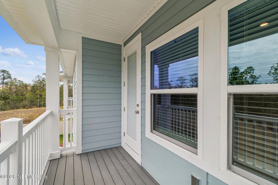 Exterior details and patio area of a home in Kettering at eTown - Paired Villas, Jacksonville (Image 3).