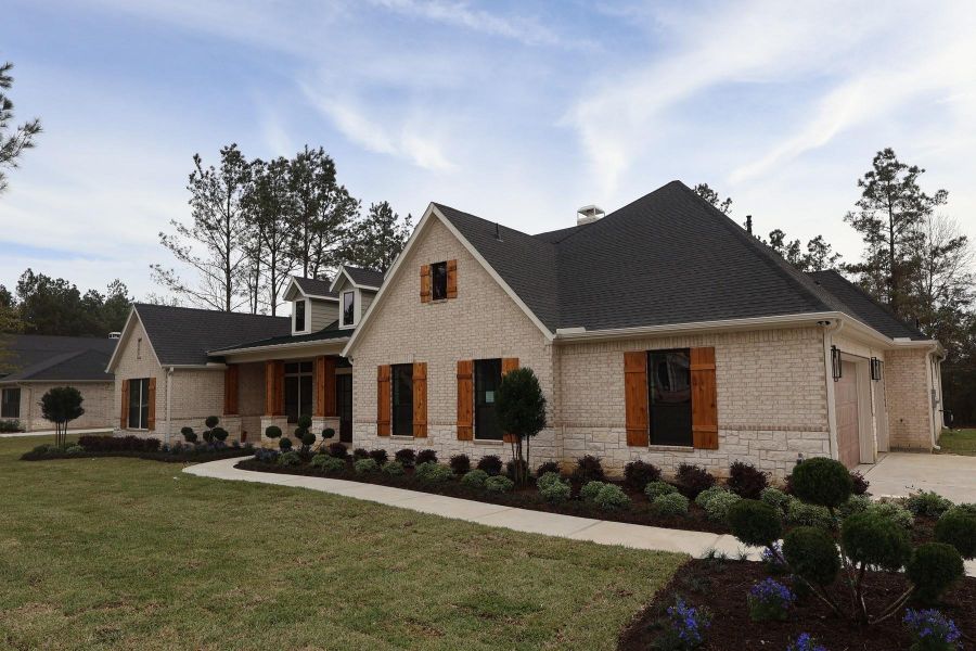 Front exterior of a new home in , Montgomery, TX, highlighting curb appeal (Image 2).
