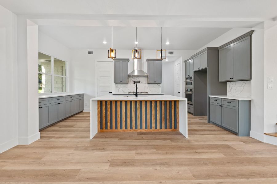 Discover effortless living in this modern, open-concept home with a kitchen that seamlessly connects to the central living area. Discover effortless living in this modern, open-concept home with a kitchen that seamlessly connects to the central living area.