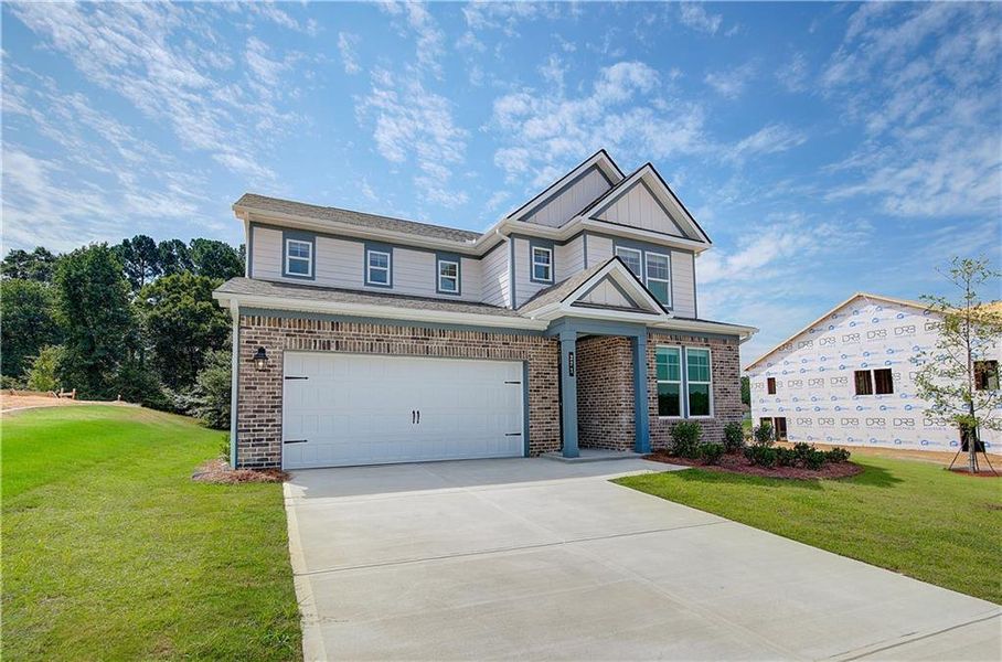 Front exterior of a new home in Abbotts Crossing, Conyers, GA, highlighting curb appeal (Image 18).