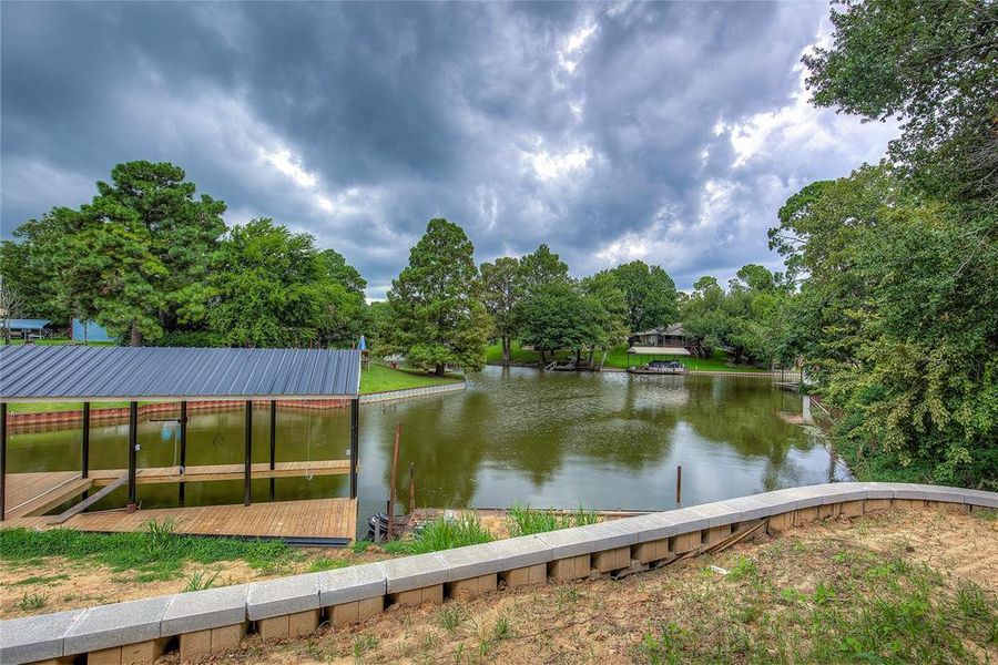 Property view of water featuring a boat dock