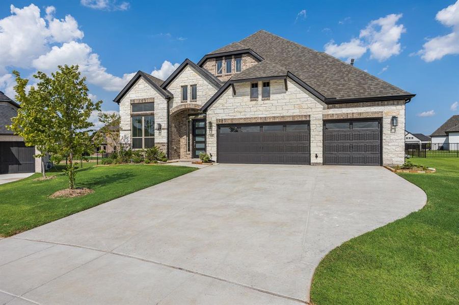 Front exterior of a new home in Heath Golf and Yacht, Heath, TX, highlighting curb appeal (Image 18).