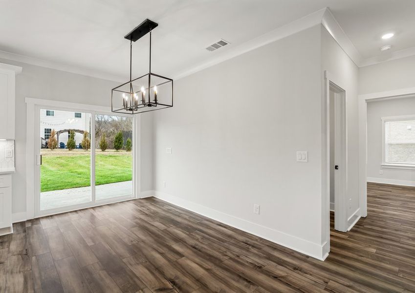 The dining area is located just off the kitchen.