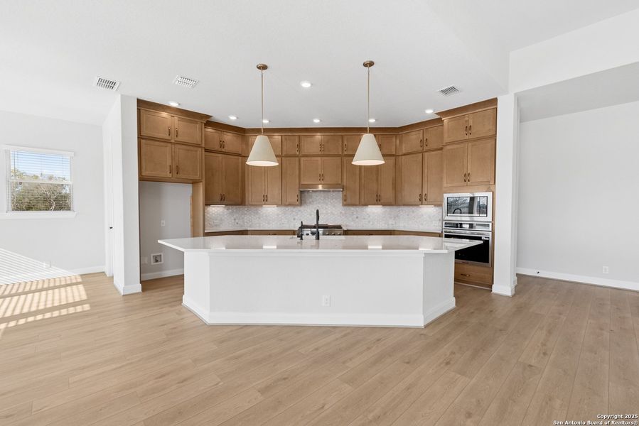 Furnished interior view inside a new home in Megans Landing – Half-Acre Homesites, Castroville (Image 9).