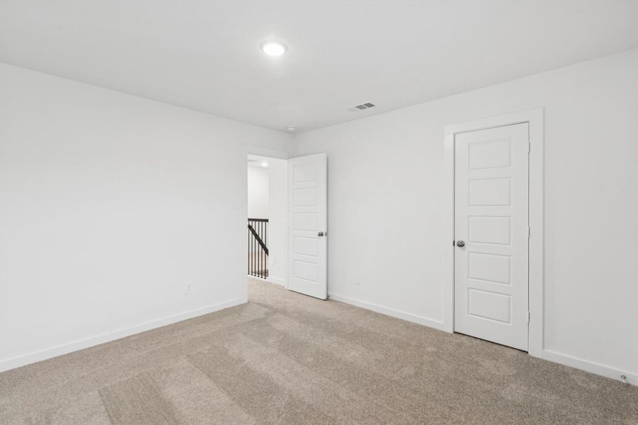 Spacious, unfurnished interior of a new home in Pinewood at Grand Texas, New Caney (Image 12).