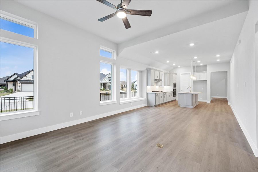 Stunning open-concept design seamlessly connecting the living, dining, and kitchen areas—perfect for both everyday living and entertaining!