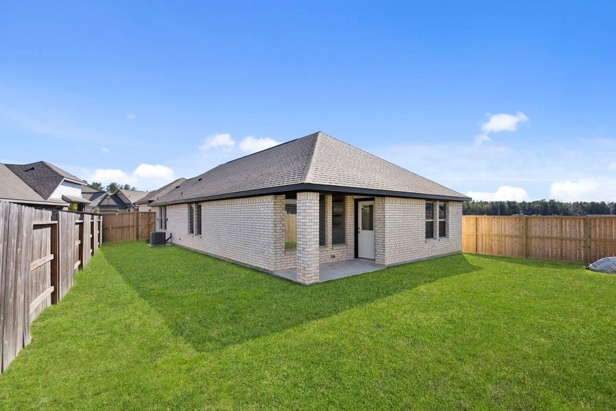Exterior details and patio area of a home in The Trails 40', New Caney (Image 22).
