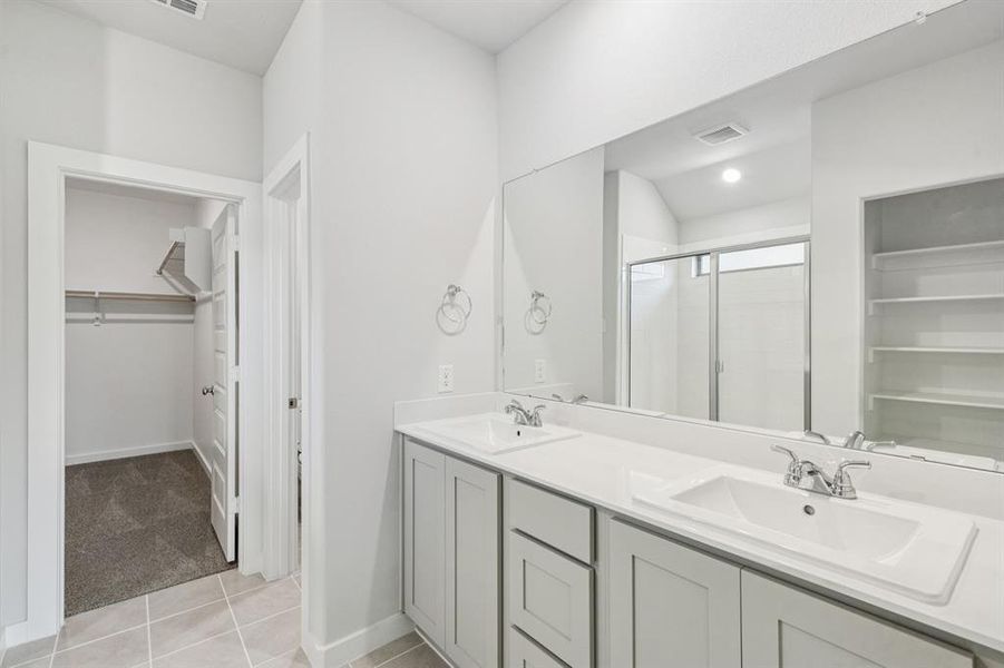 Primary Bathroom in the Oscar home plan by Trophy Signature Homes – REPRESENTATIVE PHOTO