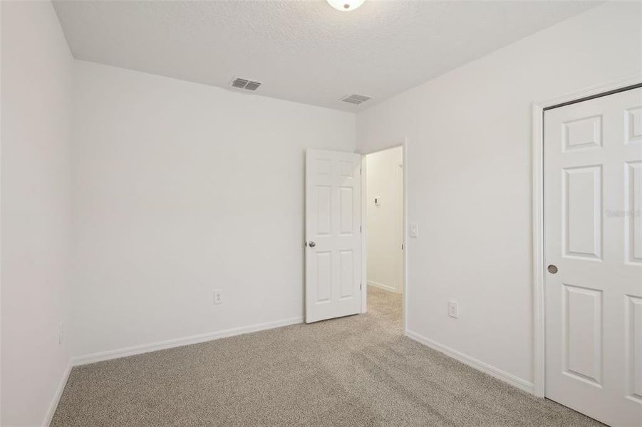 Spacious, unfurnished interior of a new home in Lake Deer Estates - Signature Series, Poinciana (Image 27). Spacious, unfurnished interior of a new home in Lake Deer Estates - Signature Series, Poinciana (Image 27).