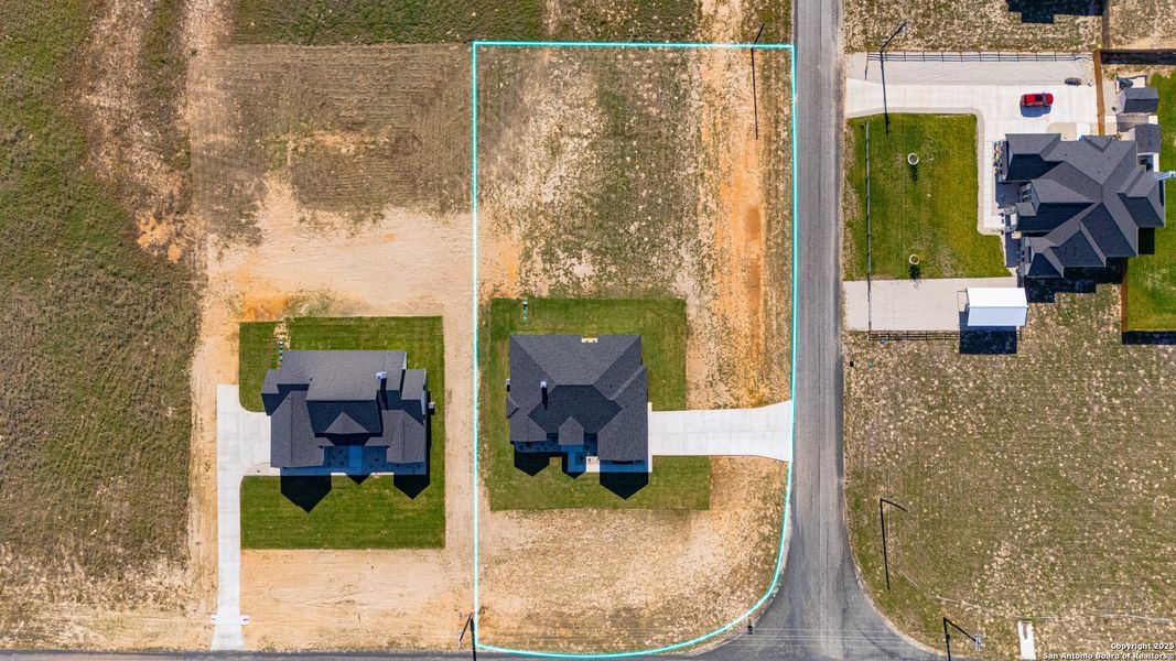 Front exterior of a new home in , La Vernia, TX, highlighting curb appeal (Image 29).