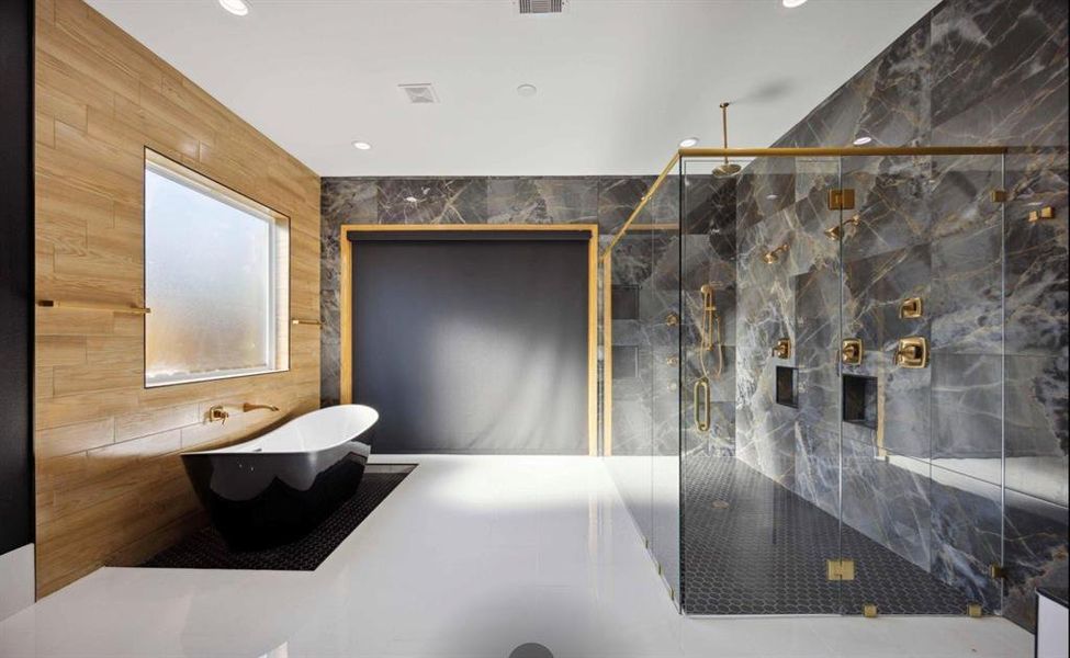 This is a modern open concept bathroom featuring a standalone bathtub and a large walk-in shower with marble walls and gold fixtures. There's a mix of textures with a wooden wall and tiled floors, complementing the sleek, contemporary design. A frosted window provides natural light and privacy.