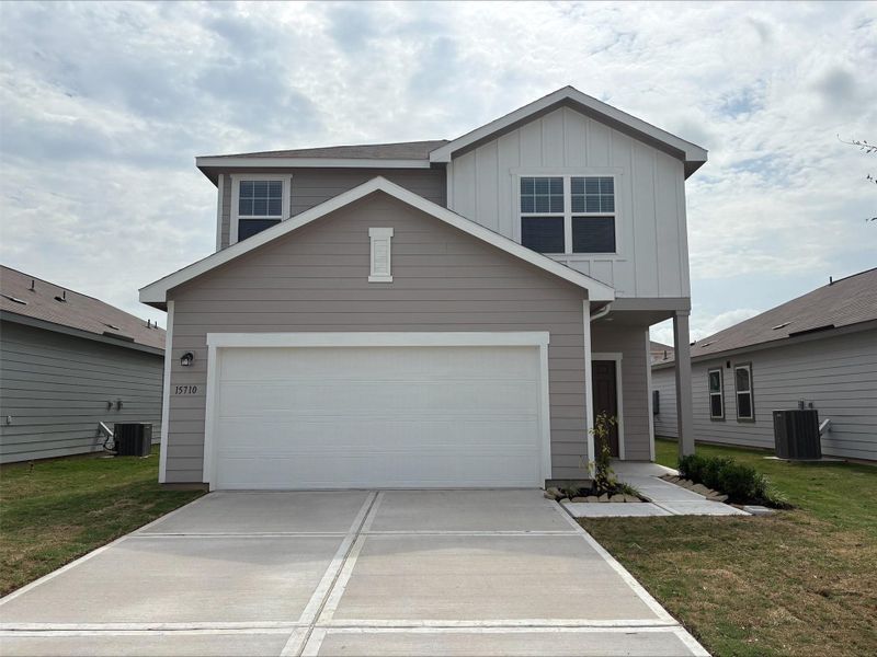 Front exterior of a new home in Cedar Pointe, Crosby, TX, highlighting curb appeal (Image 1). Front exterior of a new home in Cedar Pointe, Crosby, TX, highlighting curb appeal (Image 1).