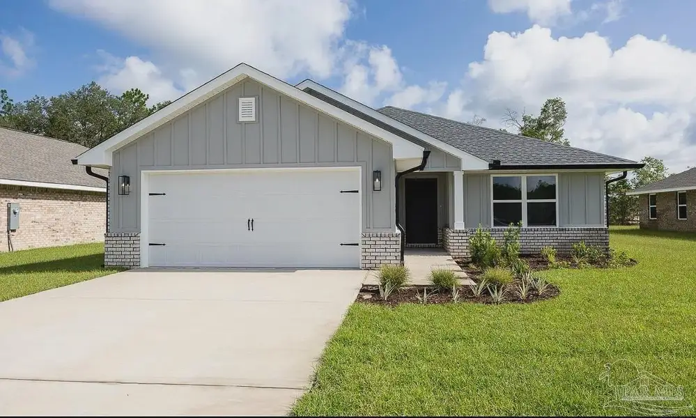 Front exterior of a new home in Hidden Pines, Milton, FL, highlighting curb appeal (Image 2). Front exterior of a new home in Hidden Pines, Milton, FL, highlighting curb appeal (Image 2).