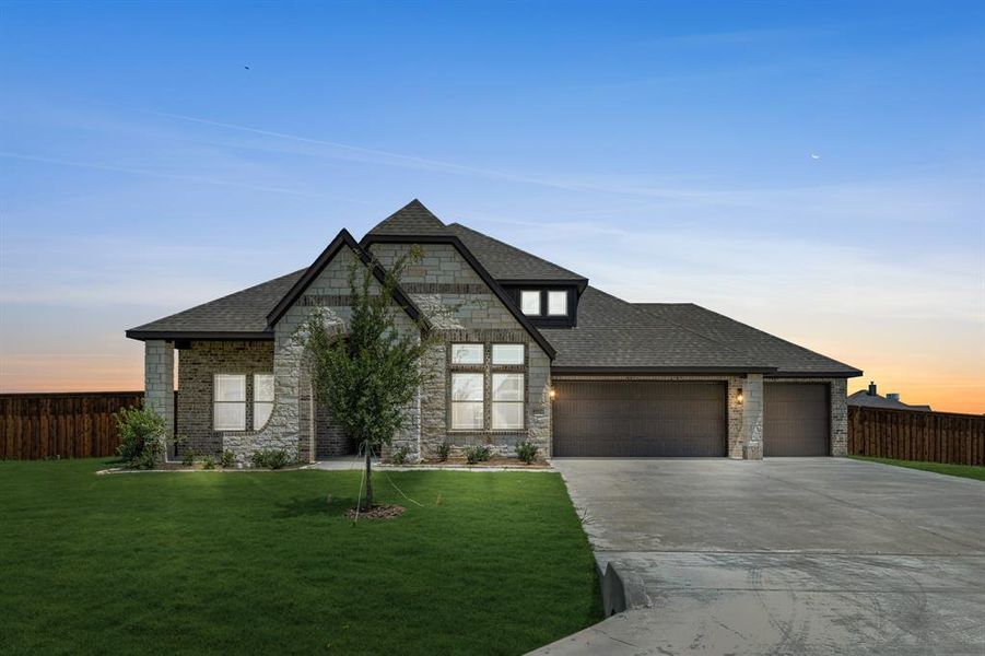 Front exterior of a new home in Wildcat Ridge Phase 2 and 4, Godley, TX, highlighting curb appeal (Image 25). Front exterior of a new home in Wildcat Ridge Phase 2 and 4, Godley, TX, highlighting curb appeal (Image 25).