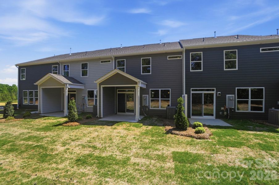 Exterior details and patio area of a home in Blythe Mill Townhomes, Waxhaw (Image 3).