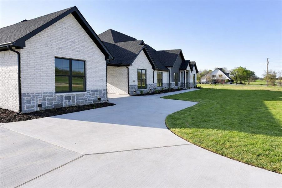 Front exterior of a new home in , Union Valley, TX, highlighting curb appeal (Image 22).