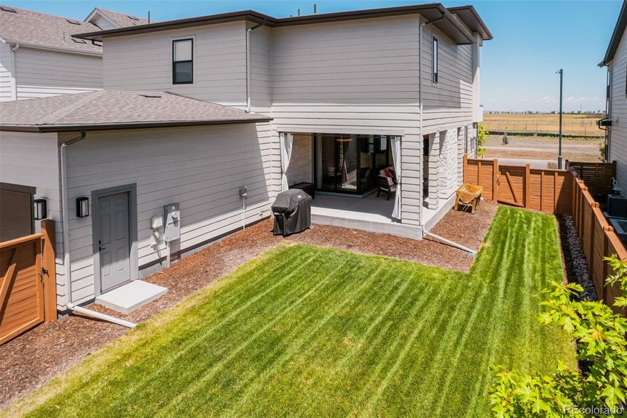 The yard, encircled by a privacy fence, strikes the perfect balance—expansive enough for gardening, play, and lively outdoor gatherings, yet conveniently sized to keep your weekends blissfully free. Bring your trampoline or playset- they will fit!