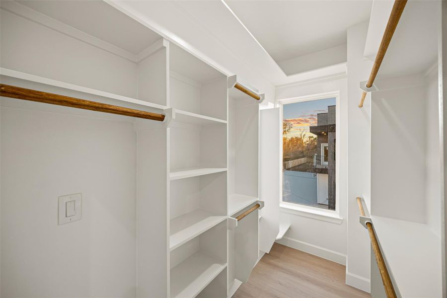 Walk in closet featuring light wood-style flooring