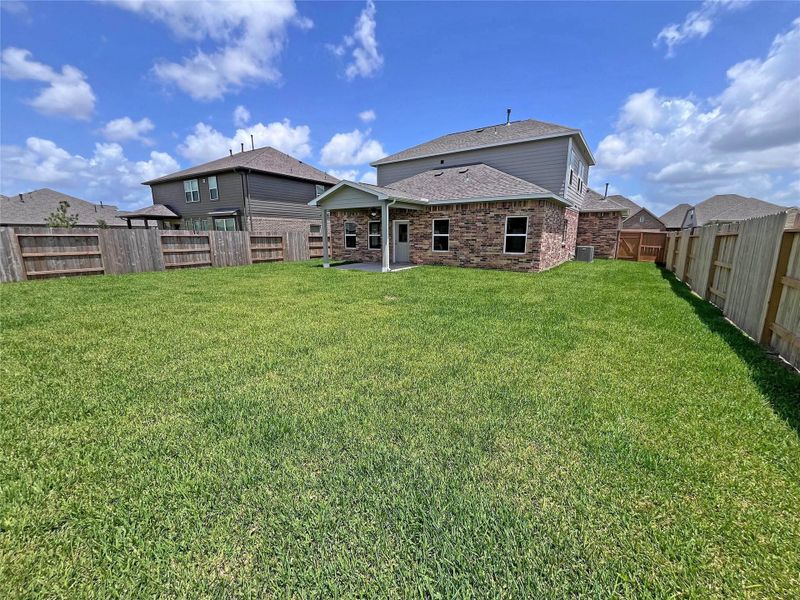 Rear Covered Patio and Backyard. Rear Covered Patio and Backyard.