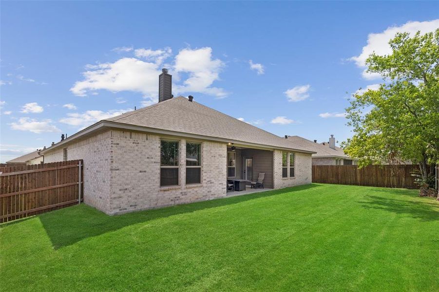 Exterior details and patio area of a home in Willow Vista Estates, Saginaw (Image 4).