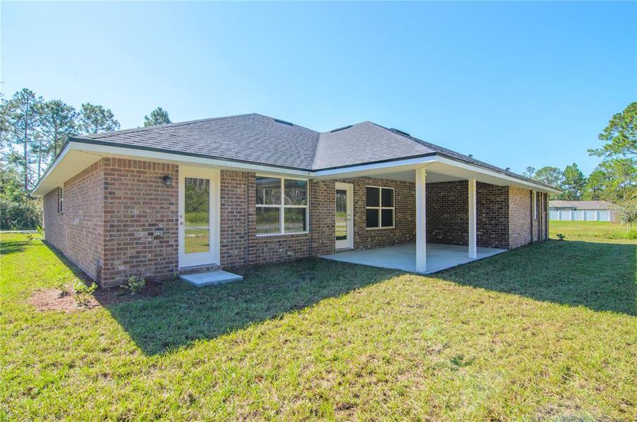 Exterior details and patio area of a home in Palm Coast, Palm Coast (Image 3).