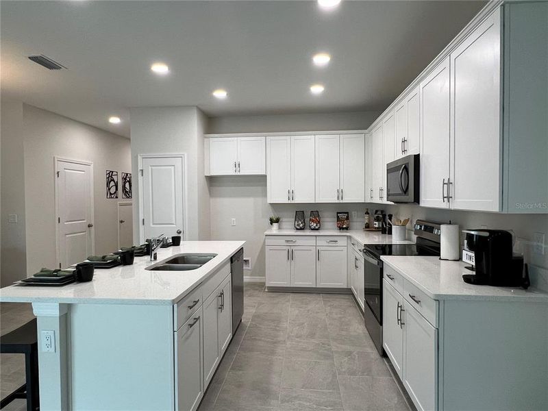 Big Kitchen Island and Lots of Cabinet Space! (photo of model home)