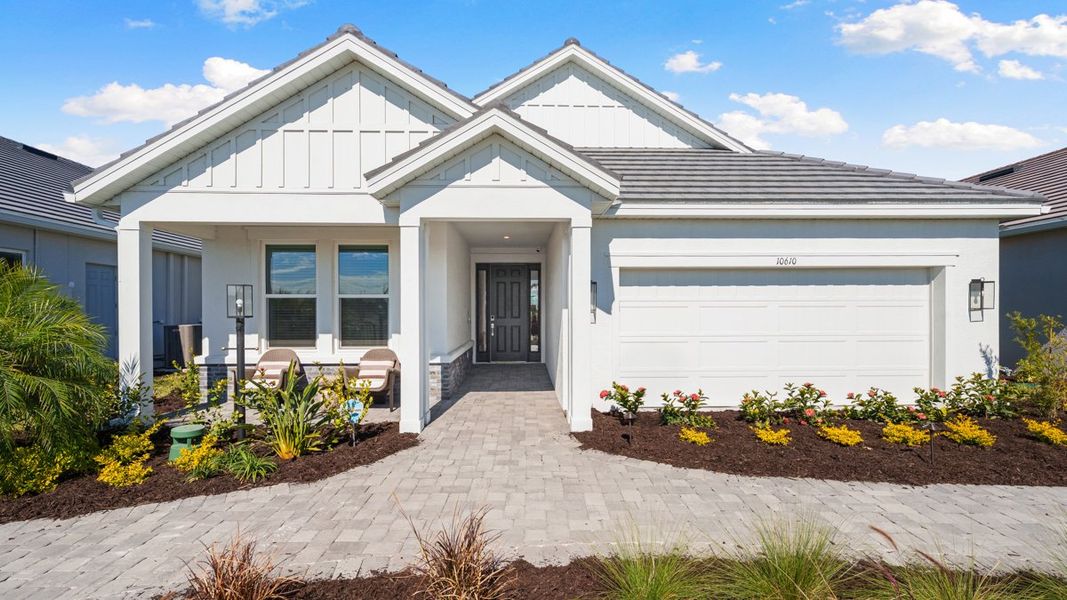 Representative exterior photo of a completed home built from the Monte by Taylor Morrison in Esplanade at Cammaray Lakewood Ranch, Sarasota, FL (Image 1). Representative exterior photo of a completed home built from the Monte by Taylor Morrison in Esplanade at Cammaray Lakewood Ranch, Sarasota, FL (Image 1).