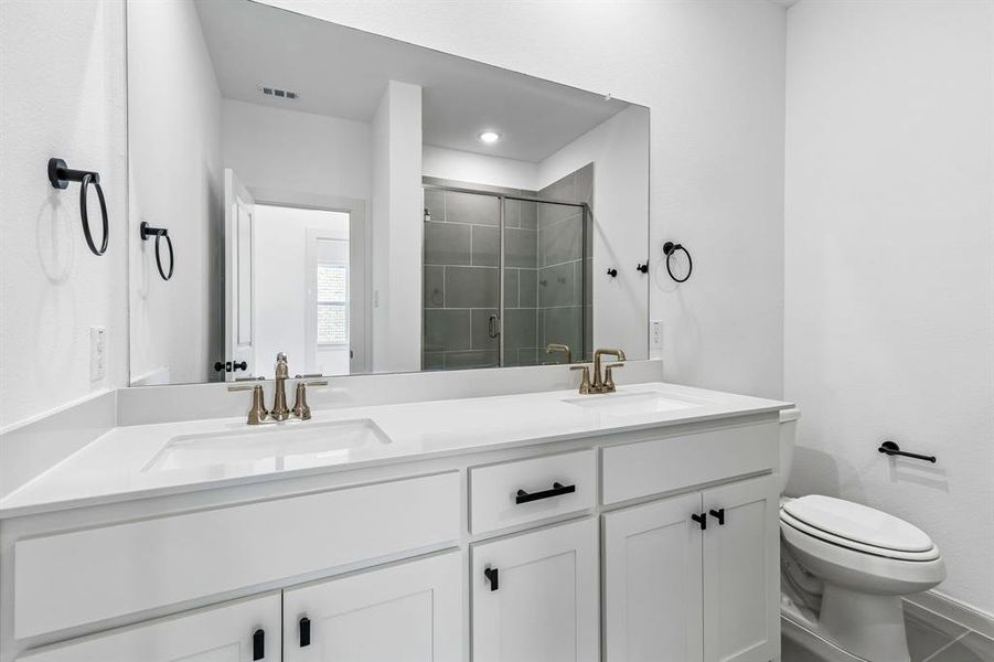 Friends and family will feel right at home in either of the beautifully finished guest baths in our Giselle plan.