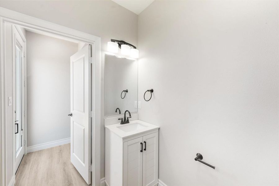 Half Bath / Laundry Room conveniently located by the back door just off the back deck. Half Bath / Laundry Room conveniently located by the back door just off the back deck.