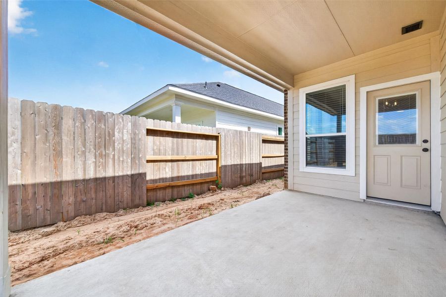 Exterior details and patio area of a home in La Segarra, Brookshire (Image 24).