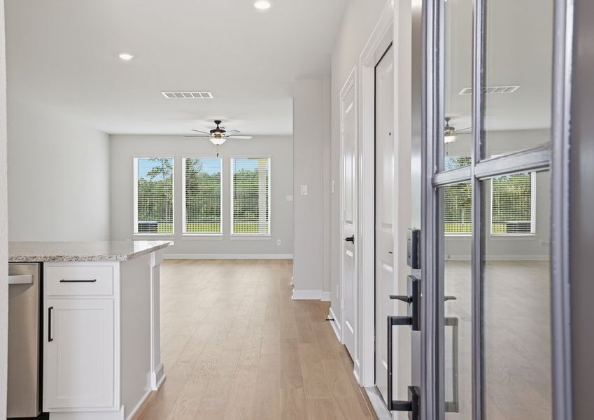 Foyer entryway featuring a glass front door and wood-look flooring.