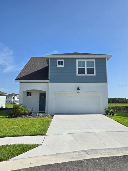 Front exterior of a new home in , Hudson, FL, highlighting curb appeal (Image 1).