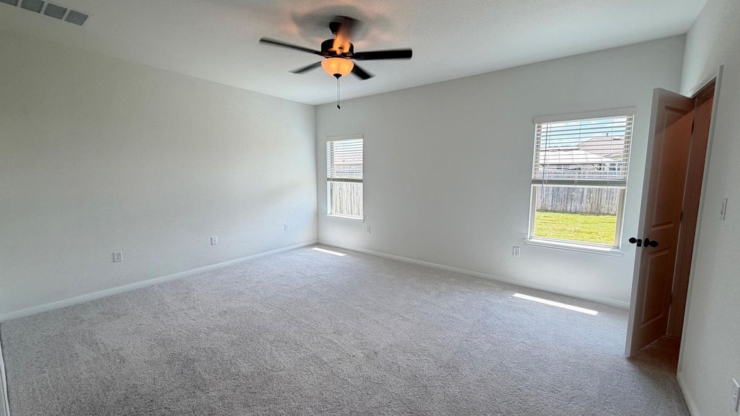 An airy bedroom with fresh carpeting and ample natural light awaits your personal touch. An airy bedroom with fresh carpeting and ample natural light awaits your personal touch.
