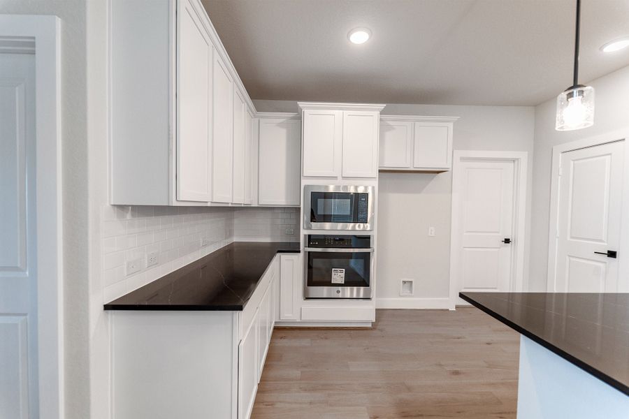 Furnished interior view inside a new home in The Woodlands at Medina Hills, Mico (Image 7).