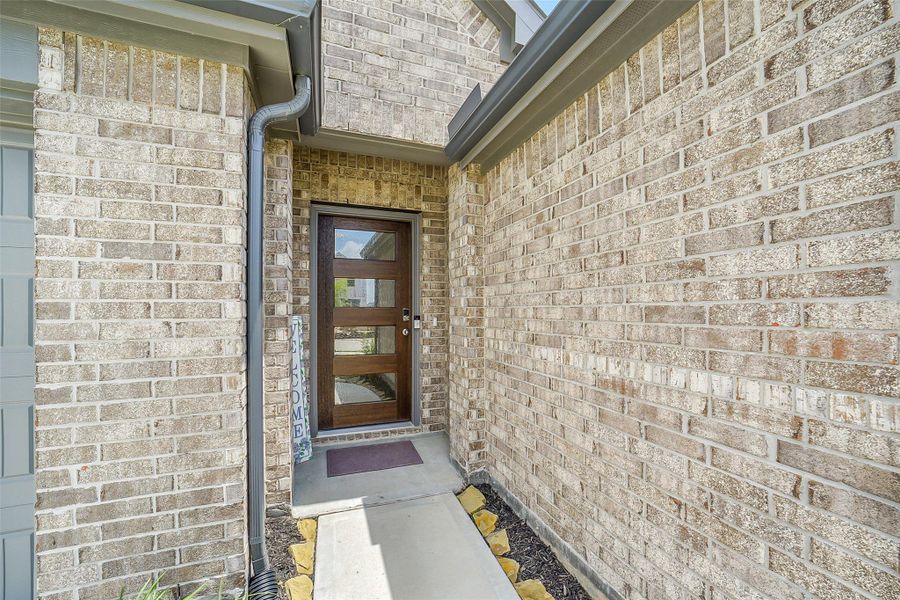 Exterior details and patio area of a home in Sunterra, Katy (Image 23). Exterior details and patio area of a home in Sunterra, Katy (Image 23).