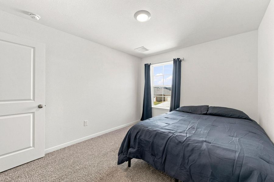 Plush carpeting and a classic multi-lite window define this quiet, comfortable space.