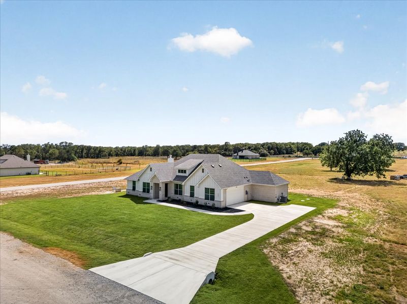 Front exterior of a new home in Taylor Ranch, Springtown, TX, highlighting curb appeal (Image 31).