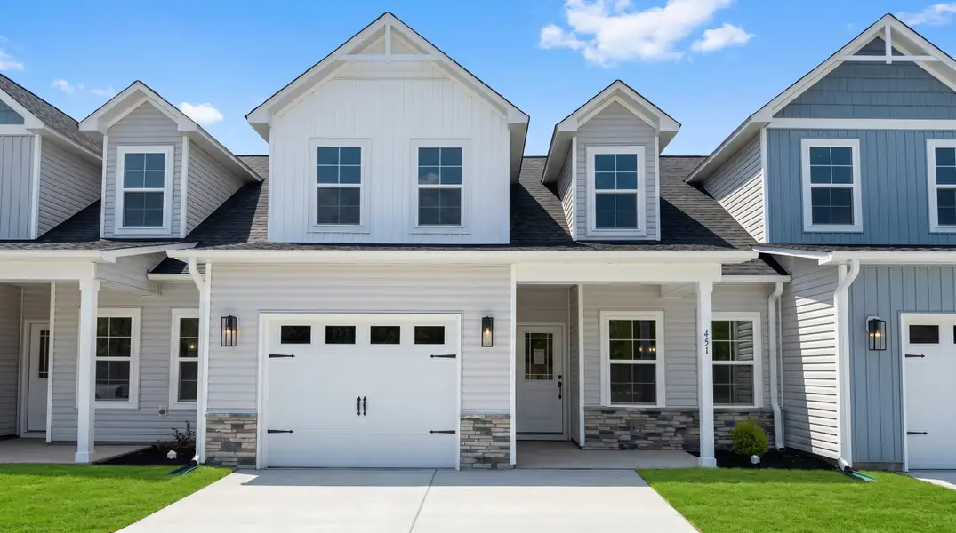 Front exterior of a new home in Autumn Trail, Bolivia, NC, highlighting curb appeal (Image 1). Front exterior of a new home in Autumn Trail, Bolivia, NC, highlighting curb appeal (Image 1).