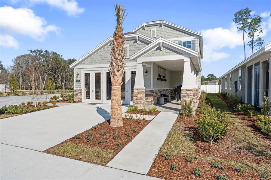 Front exterior of a new home in Seminole Palms, Palm Coast, FL, highlighting curb appeal (Image 5).