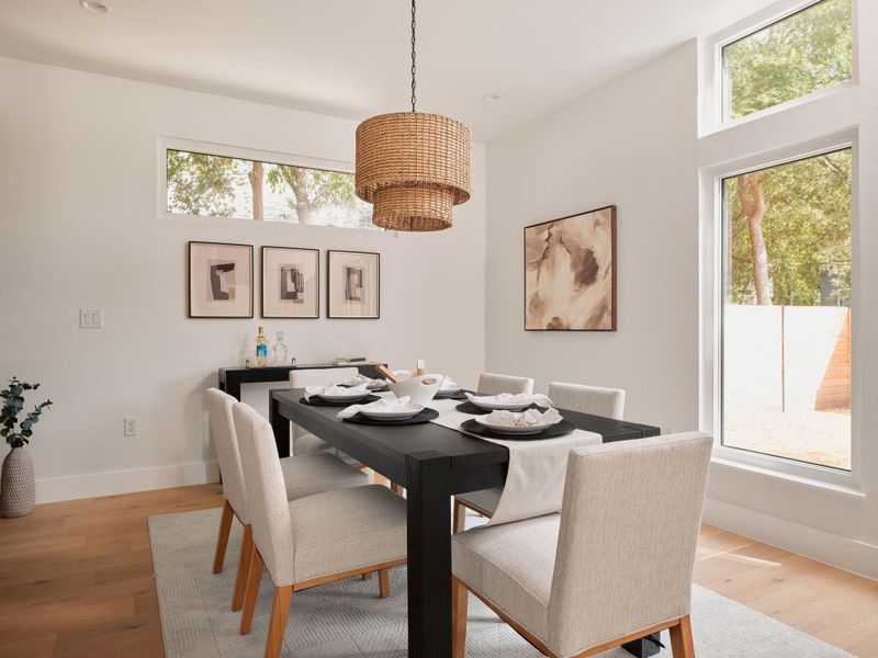 Dining space with light wood-style floors Dining space with light wood-style floors