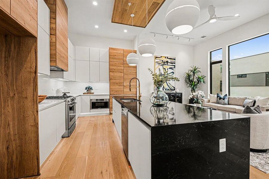A large pantry anchors one end of the kitchen.  Plentiful cabinet storage.