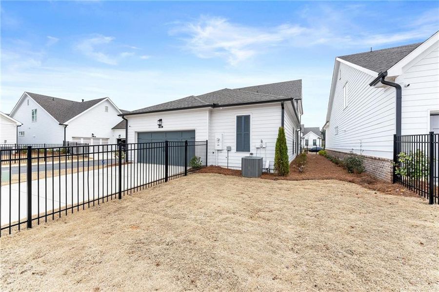 Exterior details and patio area of a home in Promenade at Sawnee Village, Cumming (Image 30).