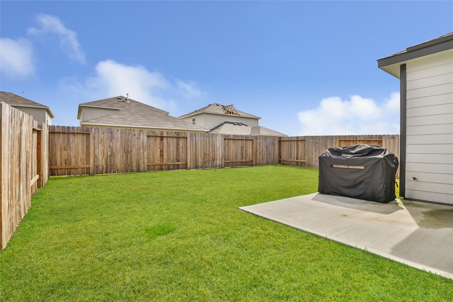 Exterior details and patio area of a home in Barrett Crossing, Crosby (Image 4).