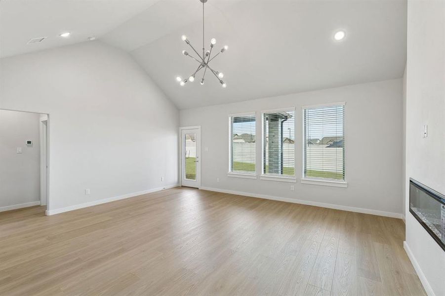 Dining and Living Room in the Stanley II home plan by Trophy Signature Homes – REPRESENTATIVE PHO