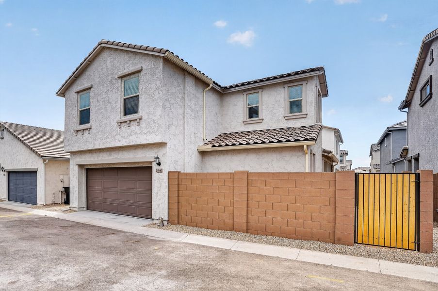 Front exterior of a new home in Rancho Mercado, Surprise, AZ, highlighting curb appeal (Image 2). Front exterior of a new home in Rancho Mercado, Surprise, AZ, highlighting curb appeal (Image 2).