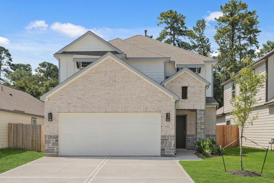 Front exterior of a new home in Cypresswood Landing, Humble, TX, highlighting curb appeal (Image 25).